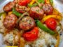 Sausage, Onion, Bell Peppers & Tomatoes over Rice